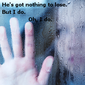 hand of young  woman  melancholy and sad  at the window in the rain