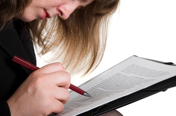 woman's hand, pen and document isolated on the white background