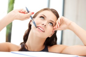 Happy woman with big notepad