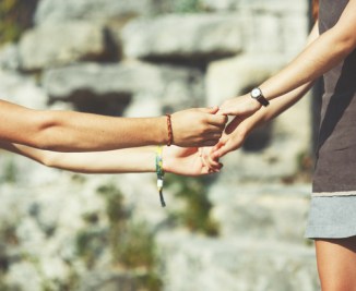 Hands of teen couple